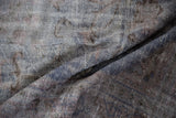 Textured vintage Oushak pile in dusty denim blue and pale mauve colors.
