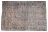 Vintage distressed Sparta rug with faded medallion, floral border in silver, blush, and denim blue.