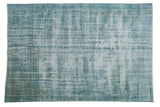 Distressed vintage overdyed Oushak carpet featuring faded turquoise, ivory, and charcoal subtle motifs, 5'5
