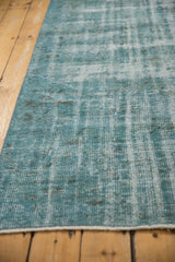 Subtle design and texture of a distressed overdyed Oushak rug in dusty turquoise.