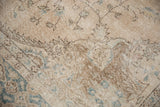 Distressed pile texture of this vintage Sparta carpet, with muted ivory and dusty teal vinery.