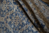 Distressed Sparta rug pile with worn dusty denim blue and antique ivory hues.