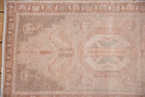 Textured detail of distressed Oushak rug pile, showing even wear and subtle tone-on-tone colors.