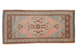 Distressed vintage Oushak rug runner, blush hexagonal floral medallion on a seafoam green ground.