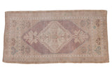 Distressed Oushak rug runner, pale lavender diamond medallion, ivory floral patterns, abrashed ground.
