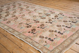 Distressed Oushak runner with abrash, blush, bronze floral motifs, and wear.