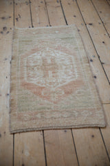 Distressed vintage Oushak rug corner detail, showing even wear and intact side selvage.