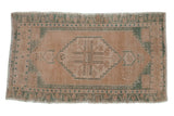 Vintage Oushak rug mat with a distressed geometric medallion in faded beige, seafoam, 1'9
