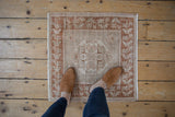 Distressed Oushak square rug mat, ivory diamond medallion, copper bronze germinating plant motifs.