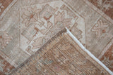 Distressed Oushak rug pile revealing faint foundation and sturdy hand-knotted backing.