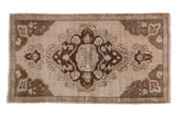 Vintage Distressed Oushak rug mat, hand knotted with ornate medallion, floral fill in ivory and chocolate brown, 1'8