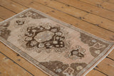 Distressed Turkish Oushak rug pile with even height and soft neutral tones.