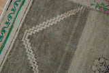 Detail of Vintage Distressed Oushak rug showing heavy abrashes, stepped motif, and emerald green.