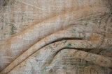Distressed vintage Oushak rug texture with ivory, seafoam green, and pale coffee brown tones.