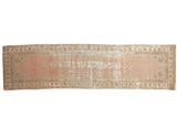 Distressed Oushak runner, dusty rose field, pinwheel spandrels, meandering floral borders. 2'8