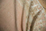 Vintage Oushak runner's distressed pile texture, revealing soft dusty rose and ivory tones.