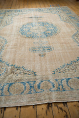 Low pile and visible foundation texture on a distressed Oushak rug.