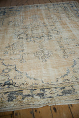 Vintage Distressed Oushak texture, worn pile revealing foundation, soft beige and dusty navy.