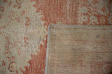 Distressed Oushak rug pile texture and woven reverse, showing foundation wear.