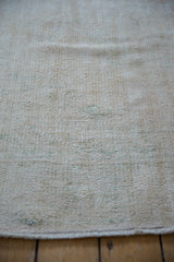 Distressed hand knotted wool pile texture of the vintage Oushak carpet.