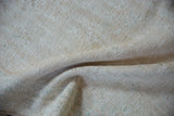 Textured hand-knotted pile of the distressed Oushak rug, showing ivory, beige, green tones.