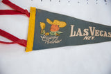 Vintage Las Vegas felt pennant with yellow trim, red ties, and Vegas Vic graphic.