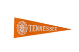 Vintage University of Tennessee felt flag in orange with white school seal and text, 9x4 inches.