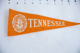 Textured orange felt with off-white University of Tennessee seal on circa 1950s pennant.