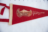 Red felt vintage pennant displaying Mt. Hood graphic, cream stitched edge, and ties.