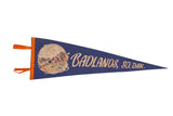Vintage blue felt pennant for Badlands, South Dakota with an orange border and Vampire Valley illustration.