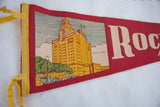 Top left corner of Rochester Minnesota felt flag showing yellow ties and Mayo Clinic graphic.