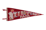 Vintage red felt Yellowstone Park pennant with bear cub and colorful landmark graphics.