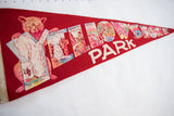 Vintage Yellowstone Park felt pennant detail with cub graphic and Old Faithful.