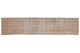 Distressed vintage Oushak runner, repeating floral gul motif, antique ivory, beige, soft brown.