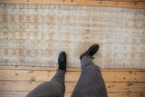 Vintage Distressed Oushak runner detail, repeating floral gul pattern with wear to knot heads.