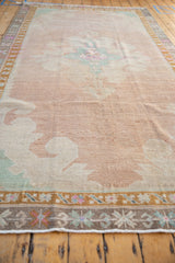 Even wear across the low pile and abrashed color field of a vintage distressed Kars carpet.