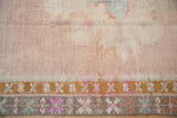Close-up of a storied patch on a vintage Kars rug, showing its distressed, low-pile texture.