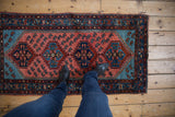Vintage Lilihan runner close-up of aqua spandrel and raspberry field with Caspian shrimp motifs.