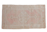Distressed Oushak runner with faded ivory and pink stepped medallion, vine motifs, 2'9