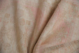 Soft, distressed Oushak rug pile revealing faded pale pink and ivory tones.