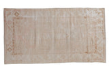 Vintage Distressed Oushak rug with faded ivory, beige, blush palette and geometric border.
