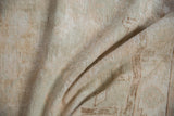 Distressed pile texture with soft folds in muted ivory, beige, and blush tones.