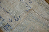 Distressed vintage Turkish Oushak runner: worn hand-knotted pile revealing foundation in ivory and pale blue.