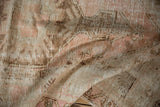 Distressed Melas rug texture: worn pile revealing foundation in coffee, blush, and ivory.