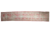 Distressed vintage Oushak runner in faded cherry red with roundel medallions and light beige.