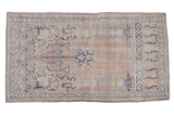 Distressed vintage Oushak rug with faded prayer design, beige and blue tones, 2'7