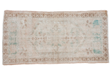 Distressed Turkish Oushak runner, faded lozenge medallion, ivory, dusty rose, pale coffee.