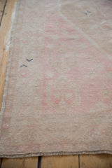 Detail of the vintage Oushak's distressed low pile and mostly even wear.