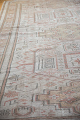 Distressed vintage Oushak carpet detail, highlighting stepped motifs and worn pile.