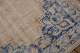 Distressed vintage Oushak rug showing mostly even wear to foundation; ivory, denim blue pattern.